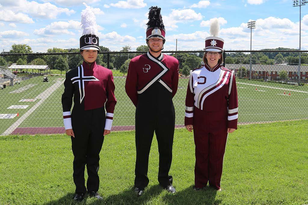 three people in uniforms